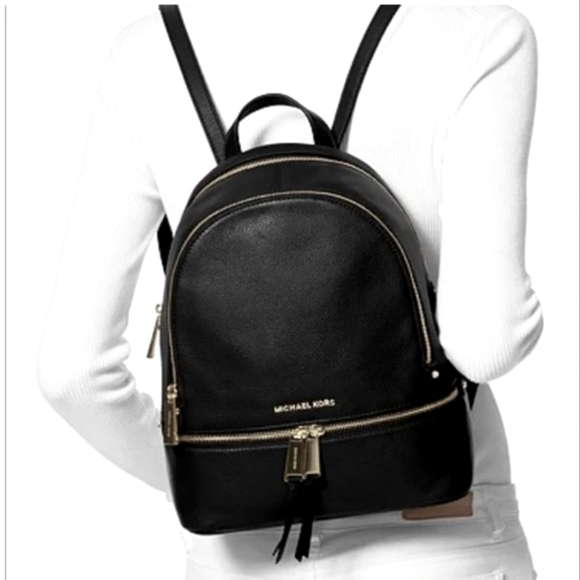 Michael Kors Handbags - EUC Michael KORS Black pebble leather Rhea silver zip Backpack pockets zippered